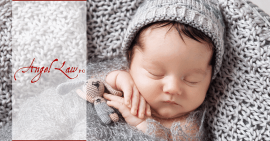 Baby snuggling in blanket